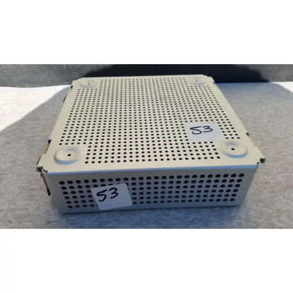 White perforated metal sterilization case with rounded corners and silicone mat for reuse medical instruments