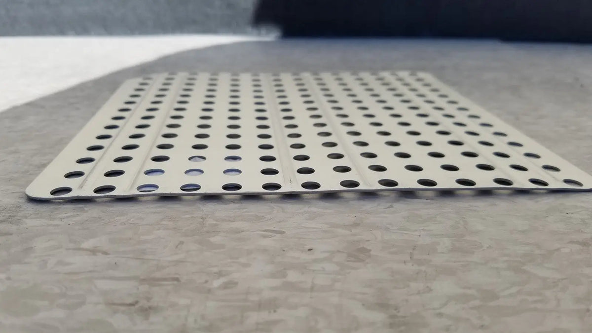 Silver perforated metal sterilization container inserts f170 with evenly spaced circular holes for secure ventilation