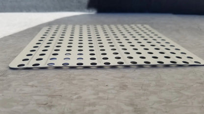 Silver perforated metal sterilization container inserts f170 with evenly spaced circular holes for secure ventilation