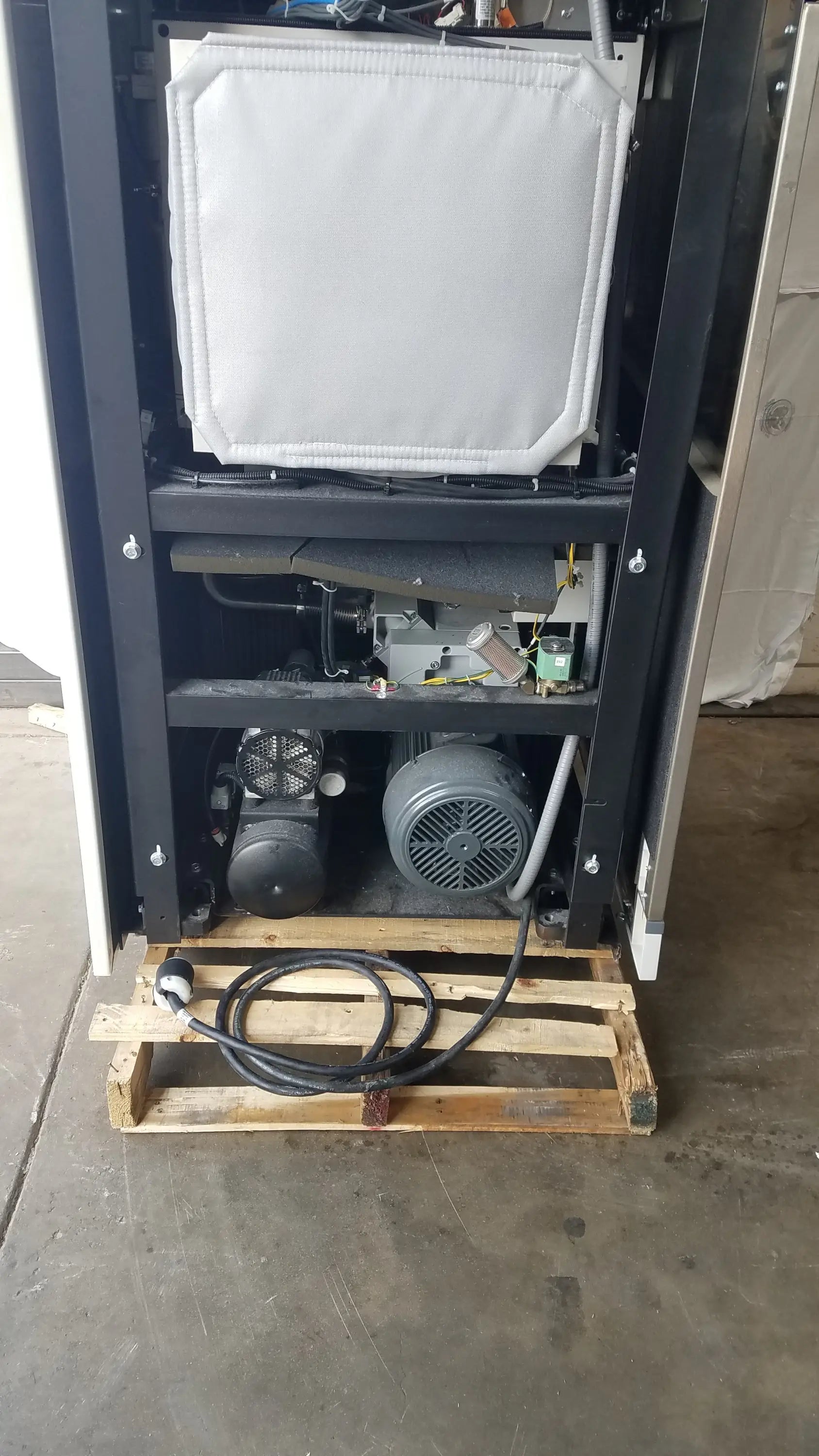 Black steris v-pro max low temperature sterilization system with white padded panel and gray motor components