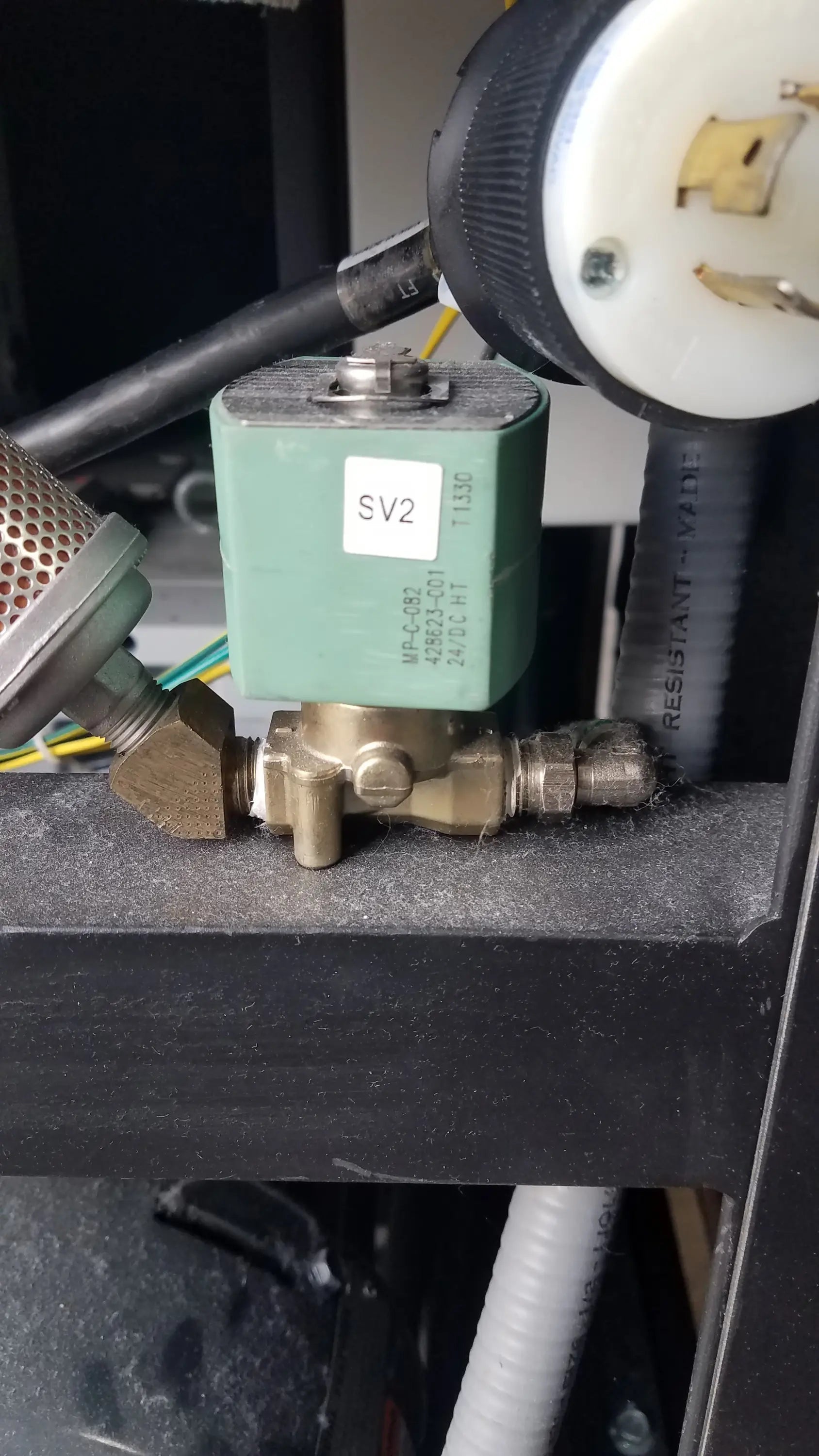 Green rectangular electromagnetic valve with brass fittings marked sv2 for steris v-pro max low temperature sterilization system