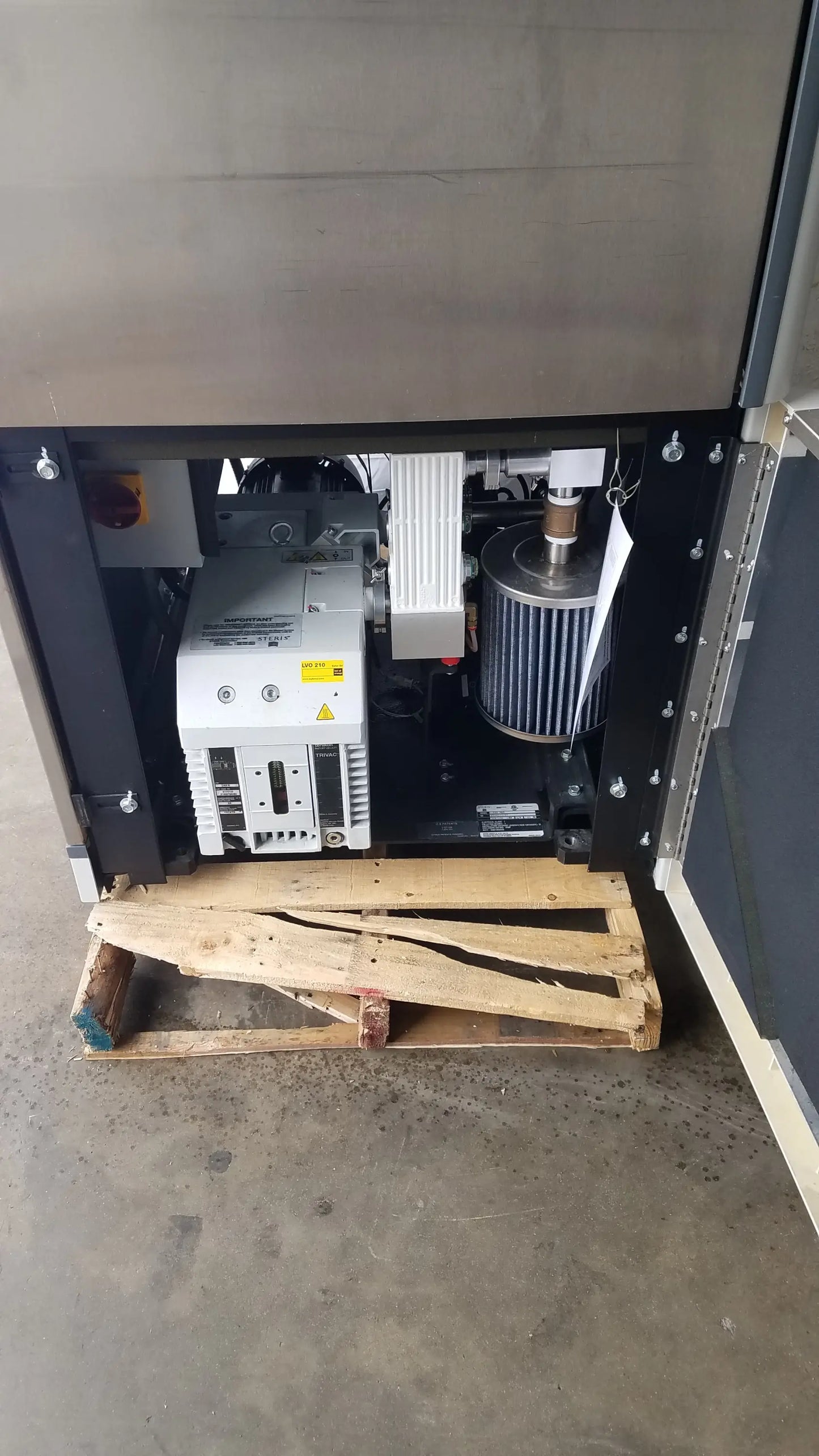 Industrial-grade steris v-pro max low temperature sterilization system with white control panel and black enclosure
