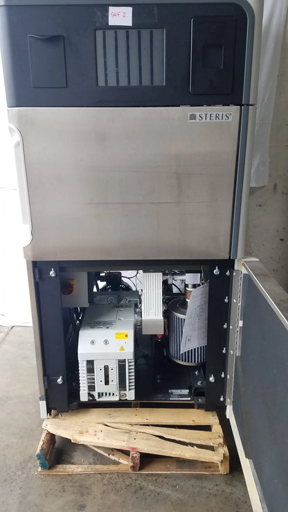 Steris V-Pro Max low temperature sterilization system with stainless steel front and black top showing internal components
