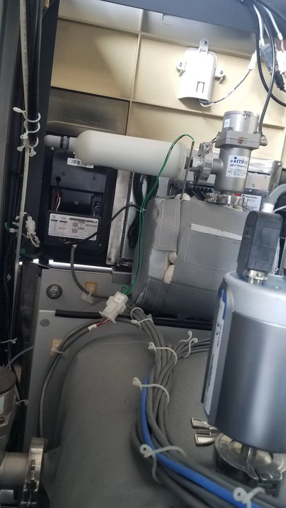 Silver industrial gas regulator with brand markings and piping on steris v-pro max low temperature sterilization system