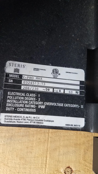 Steris v-pro max black plastic industrial air compressor with label showing model and specs for low temperature sterilization