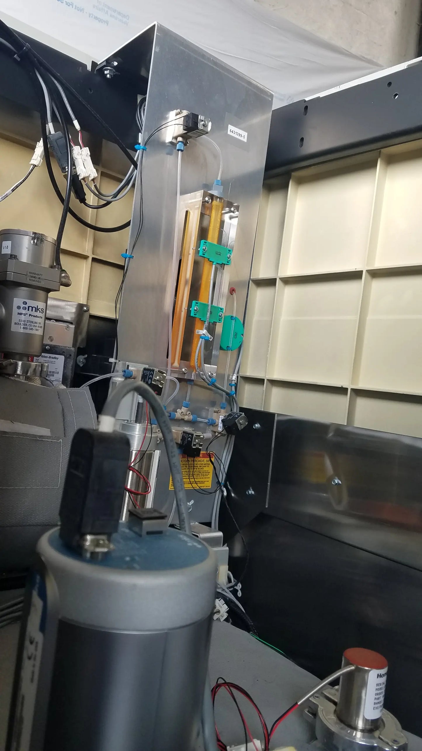 Silver metallic steris v-pro max low temperature sterilization system with transparent tubing and green connectors