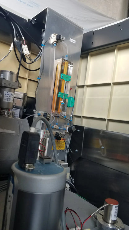 Silver metallic steris v-pro max low temperature sterilization system with transparent tubing and green connectors