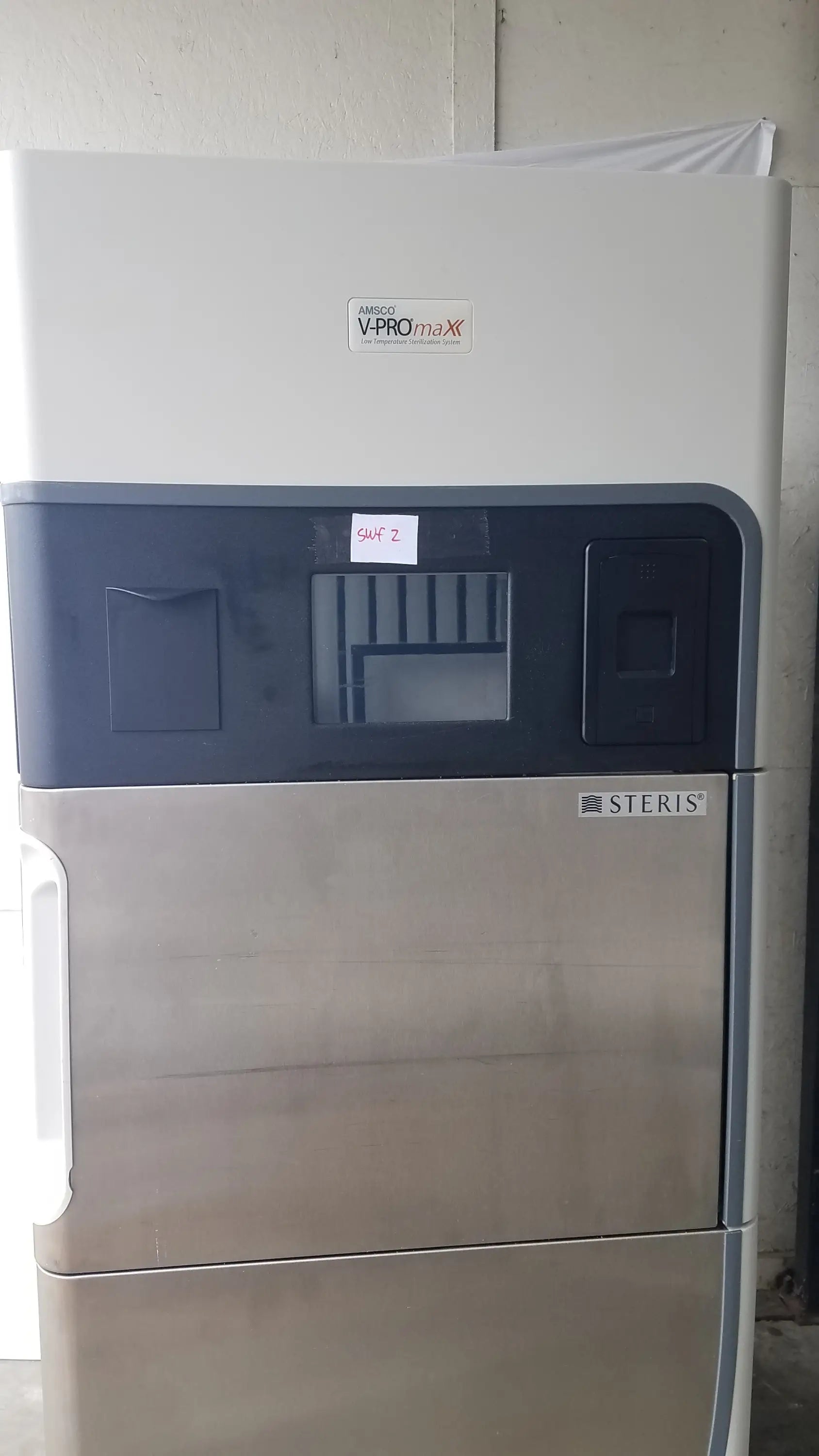 Steris V-Pro Max low temperature sterilization system with white upper section and stainless steel lower doors