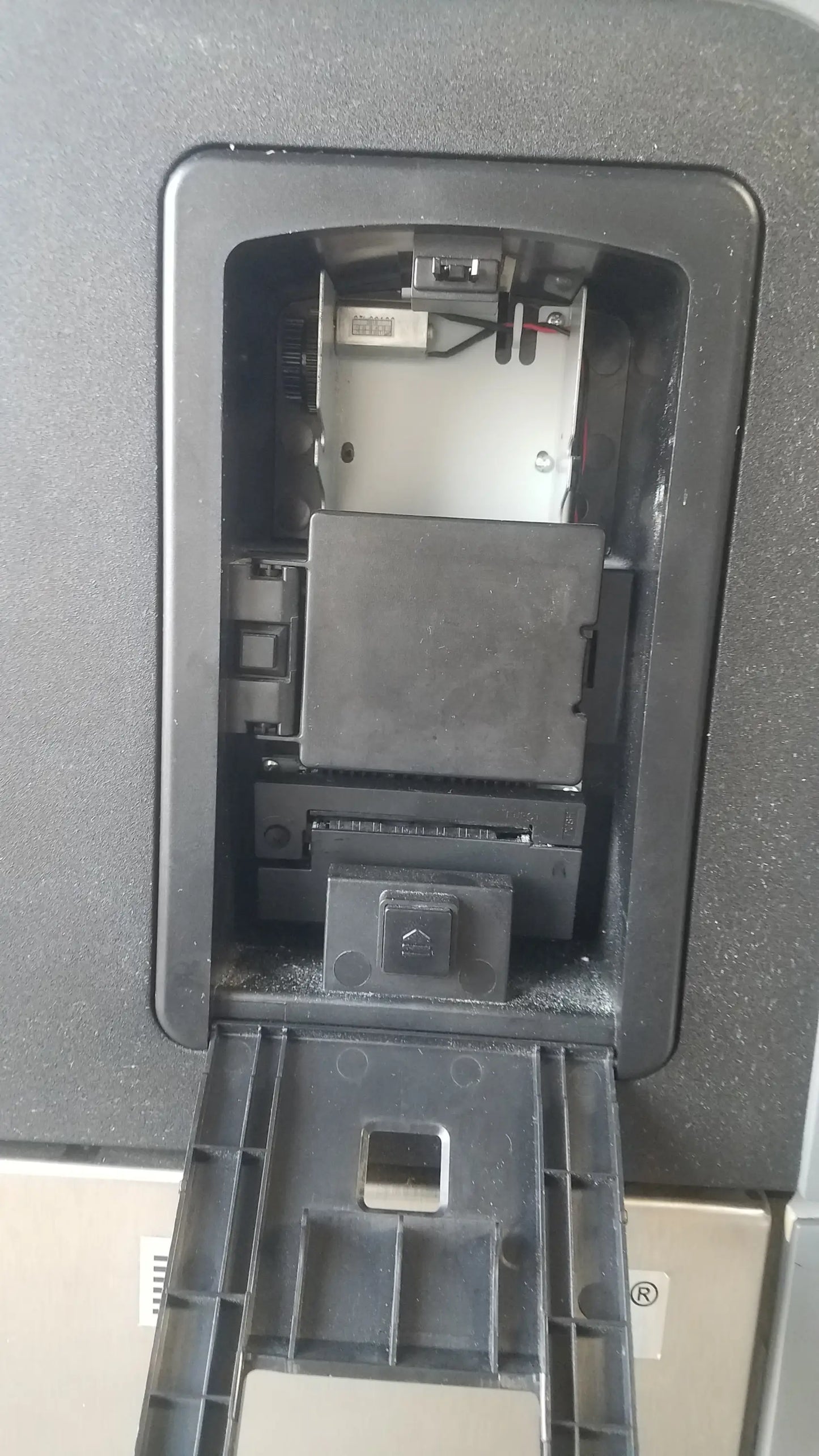 Black plastic atm card reader slot showing internal components on back of steris v-pro max low temperature sterilization system s/n 0324713-05