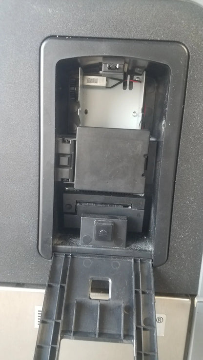 Black plastic atm card reader slot showing internal components on back of steris v-pro max low temperature sterilization system s/n 0324713-05