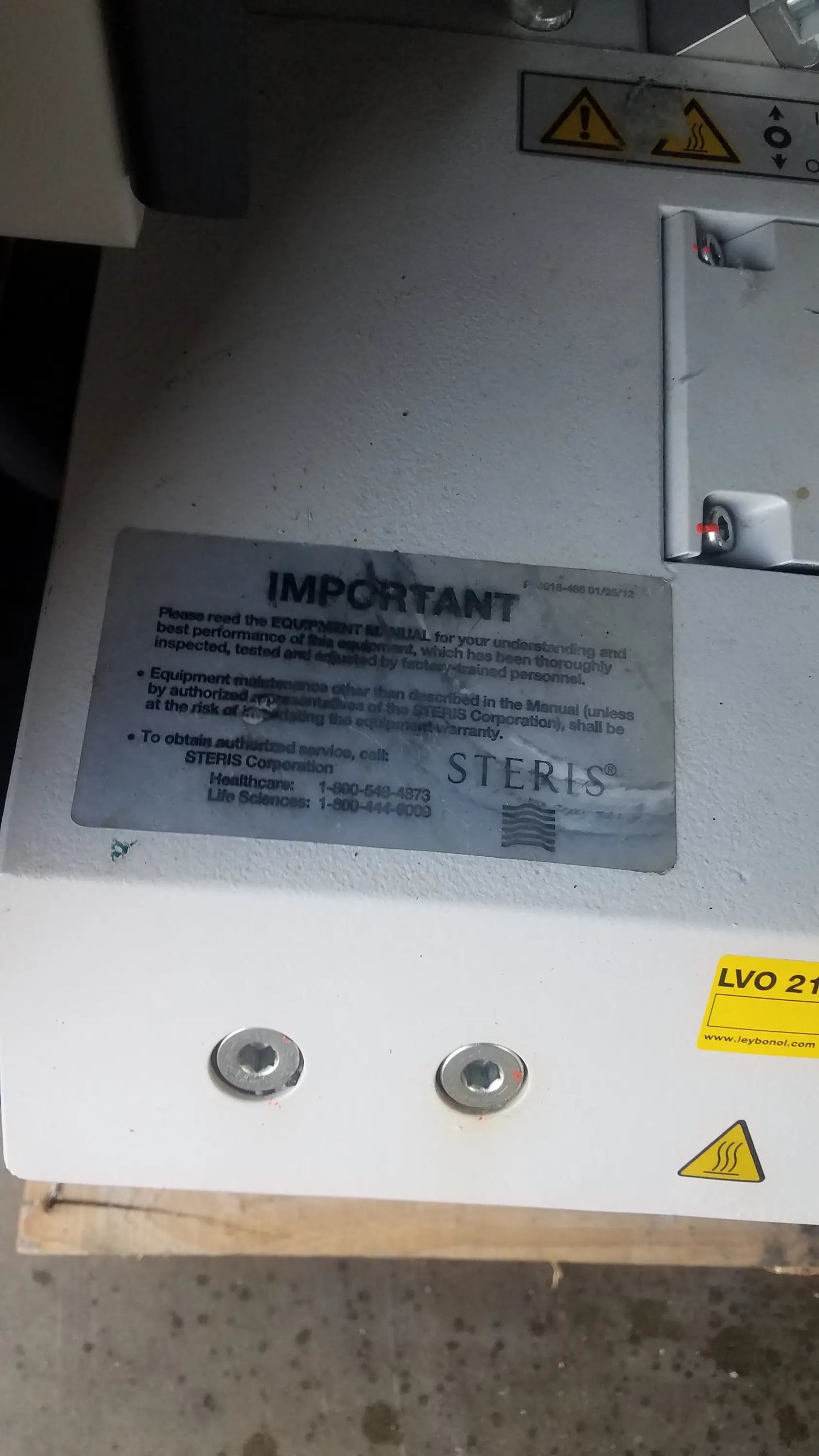 Steris lvo 210 low temperature sterilization system with white metallic casing and safety warning labels serial 0324713-05