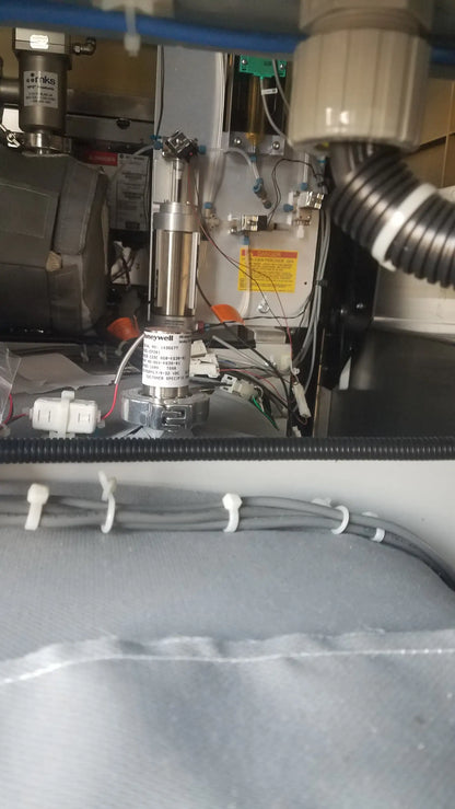 Silver cylindrical honeywell motor with metallic finish and labeled components in steris v-pro max low temperature sterilization system