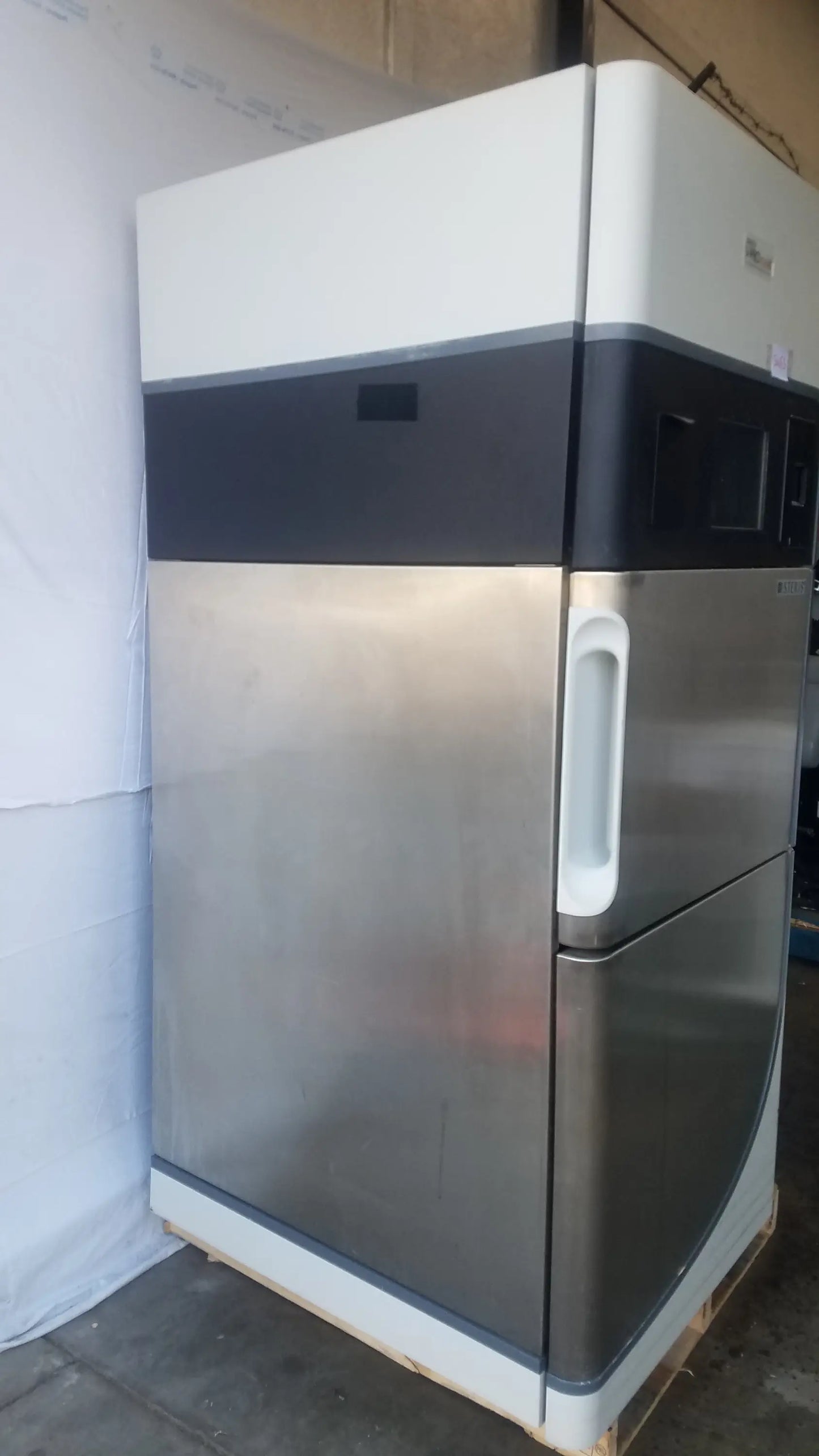 Steris V-Pro Max low temperature sterilization system stainless steel and white commercial refrigerator with black stripe