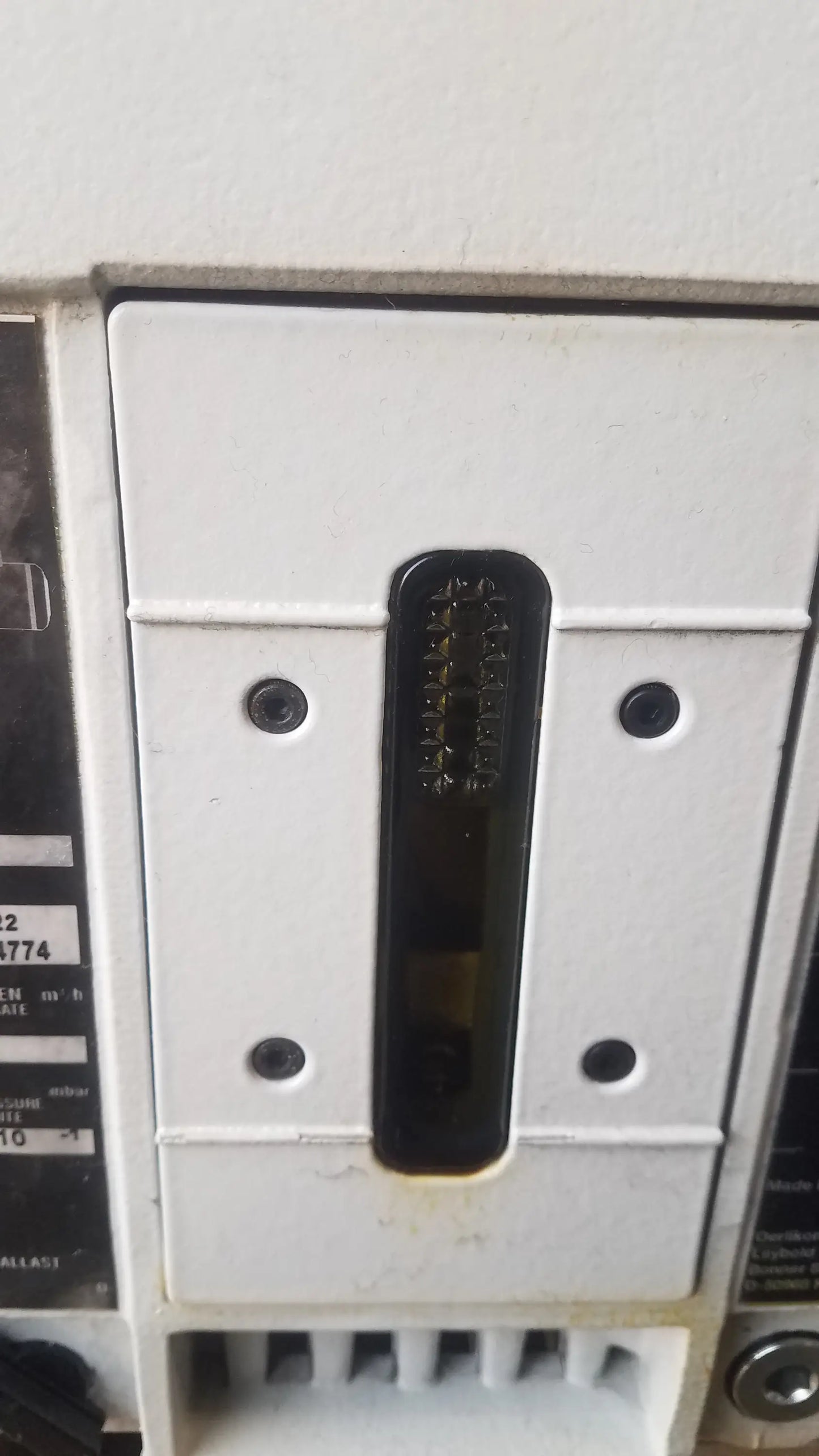 White plastic electrical circuit breaker with black handle embossed text for steris v-pro max low temperature sterilization system