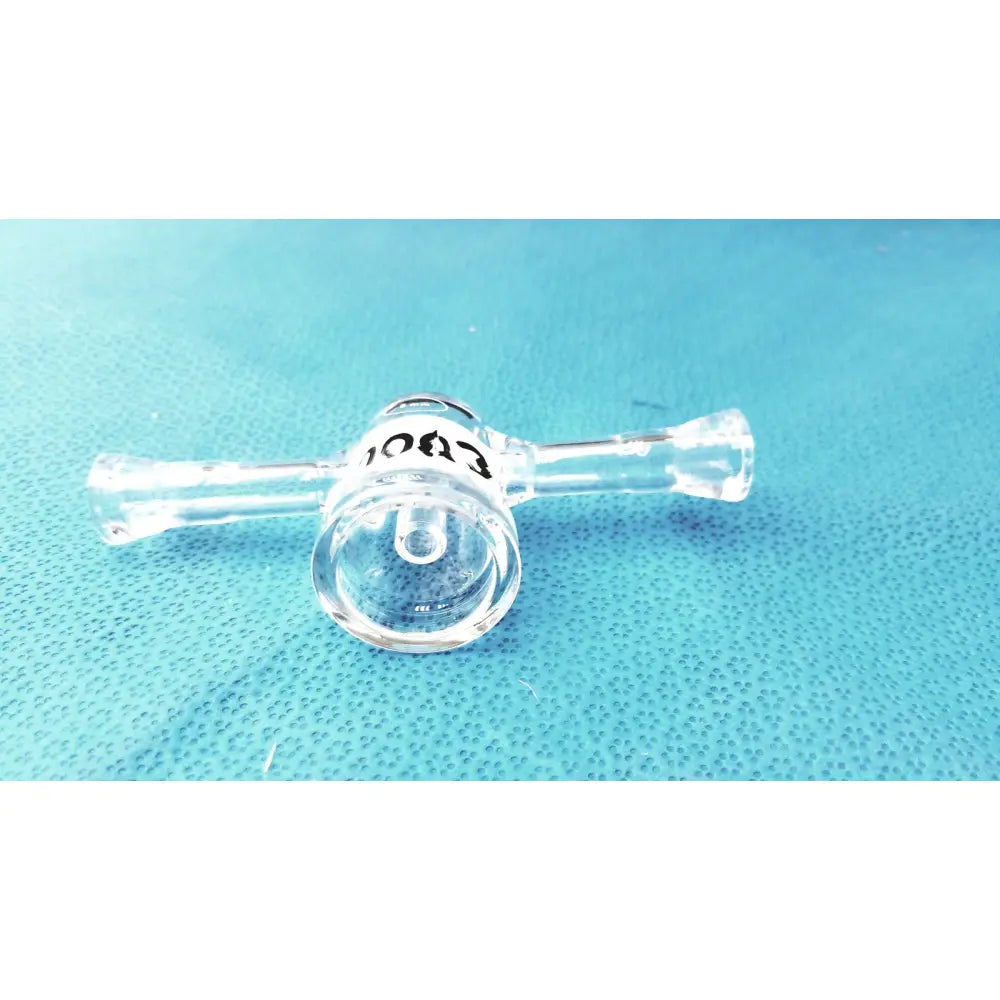 Clear borosilicate glass lab stopcock joint connector with cylindrical chamber and two horizontal arms with black text
