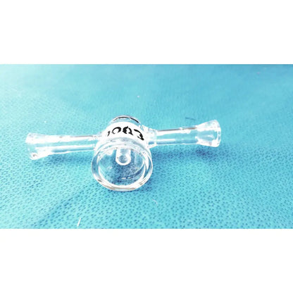 Clear borosilicate glass lab stopcock joint connector with cylindrical chamber and two horizontal arms with black text