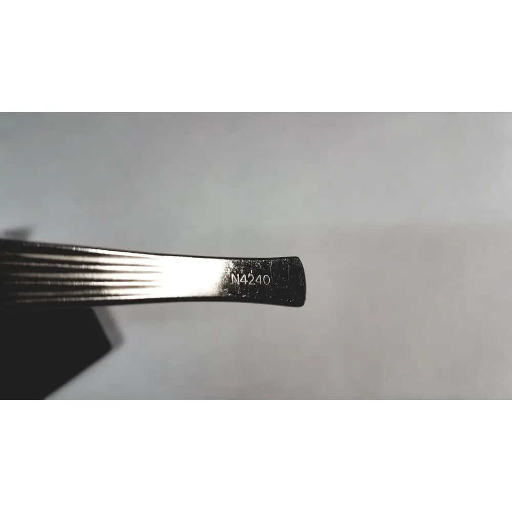 Silver-toned metal storz cottle nasal knife instrument with ribbed grip and engraved n4240 marking on handle