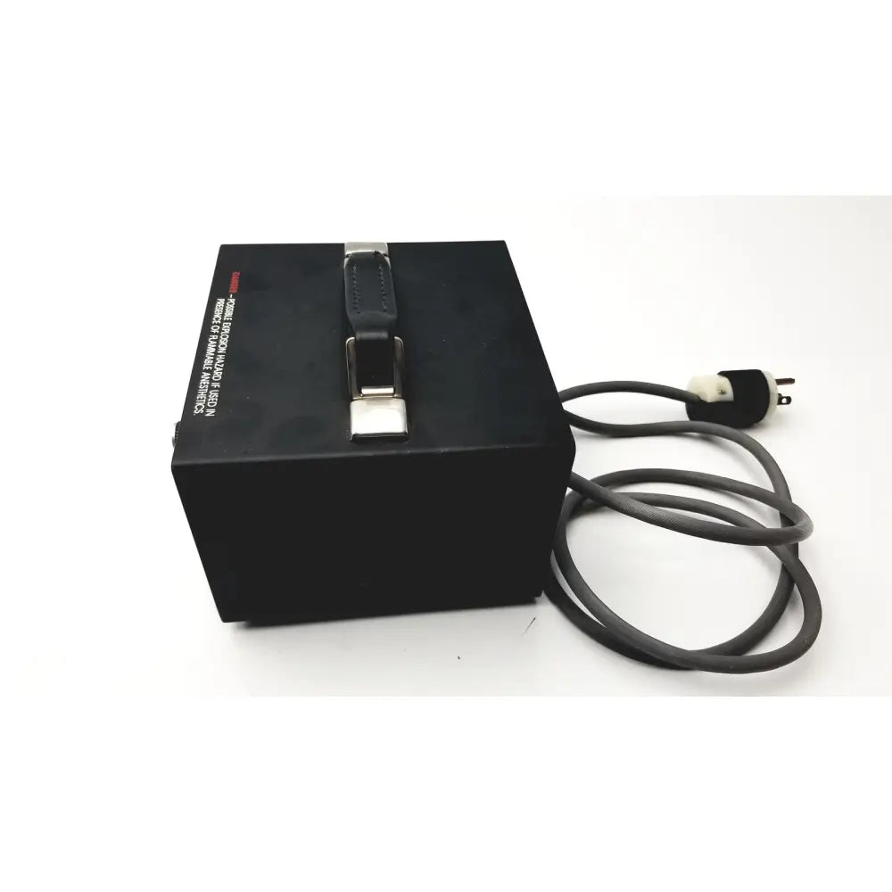 Black rectangular storz ergo surgical power supply unit with leather strap handle and coiled gray cable 130 watts