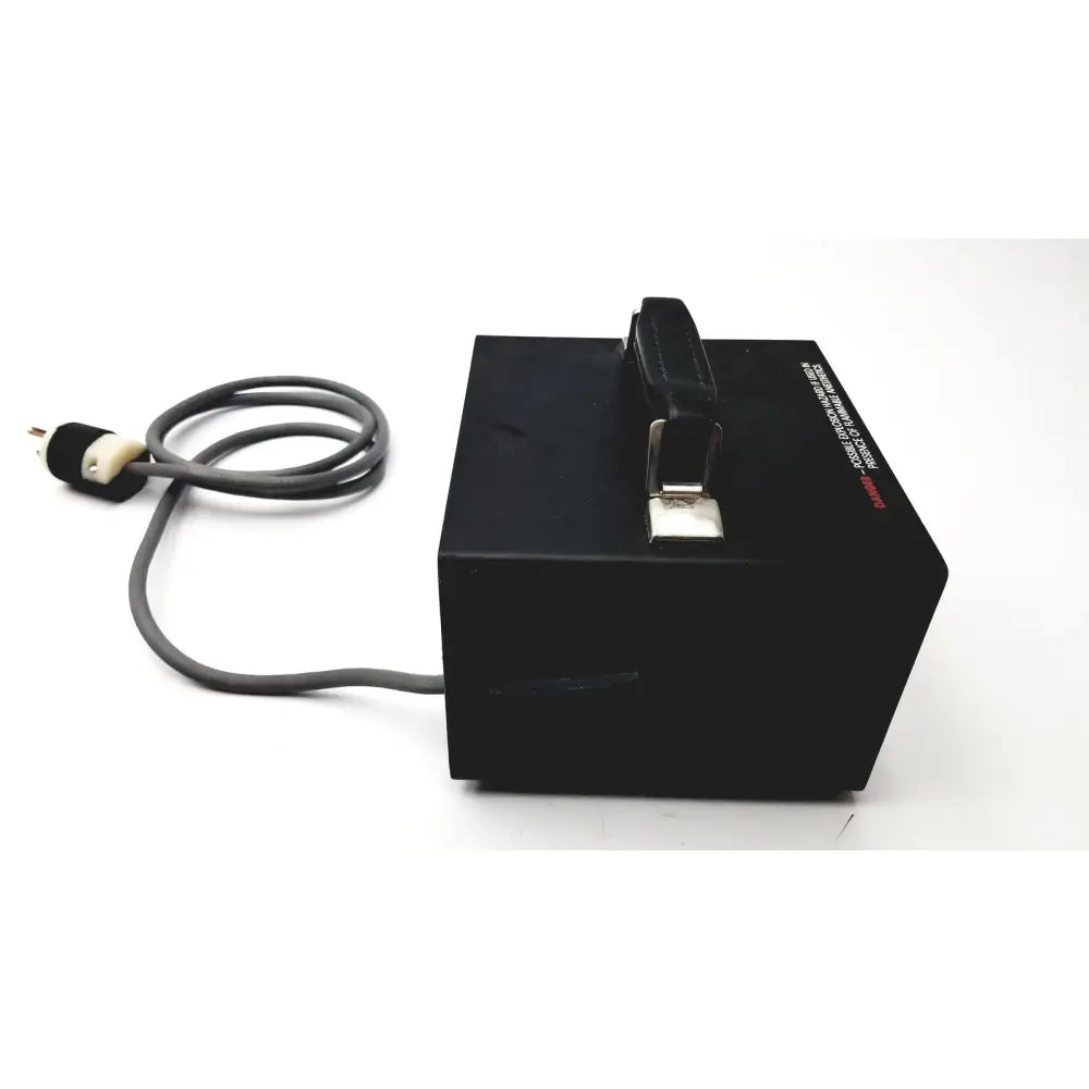 Black rectangular storz ergo surgical power supply unit with gray coiled cord and black leather handle 130 watts 115v 60hz tested