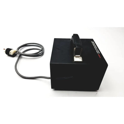 Black rectangular storz ergo surgical power supply unit with gray coiled cord and black leather handle 130 watts 115v 60hz tested