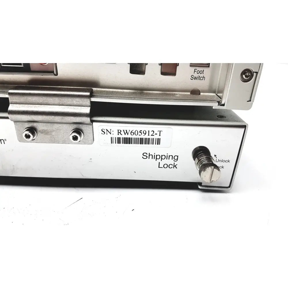 Silver metallic shipping lock with knurled knob and barcode label on the back of storz karl storz-endoscope aida hd connect