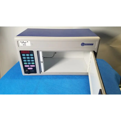 Gray and blue stradman electronic safe with digital keypad and open door for reuse medical storage of stratagene stratalinker