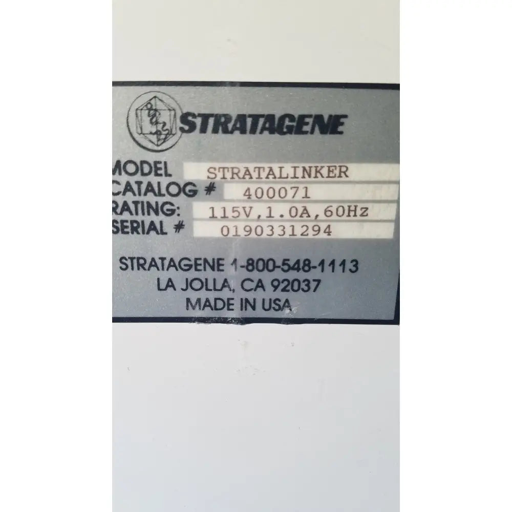 Gray metal label on the back of a stratagene stratalinker uv 1800 crosslinker for reuse medical applications