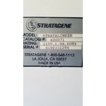 Gray metal label on the back of a stratagene stratalinker uv 1800 crosslinker for reuse medical applications