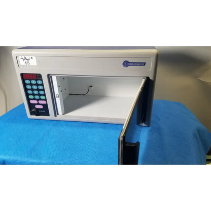 White plastic toy microwave with digital keypad and open door labeled refrak 2 in stratagene stratalinker uv 1800 crosslinker for reuse medical