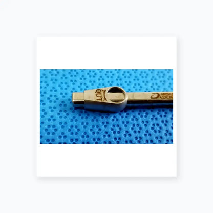 Silver metallic dental handpiece with textured grip and engraved markings for ultrasonic cleaning and reuse medical equipment