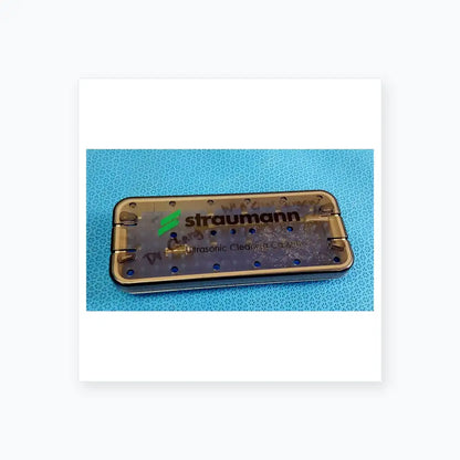 Transparent straumann ultrasonic cleaning cassette with metal frame and circular holes for reuse medical equipment cleaning