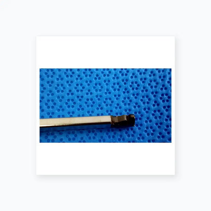 A sleek metallic torque wrench with a silver shaft and black hexagonal head for ultrasonic cleaning medical equipment reuse