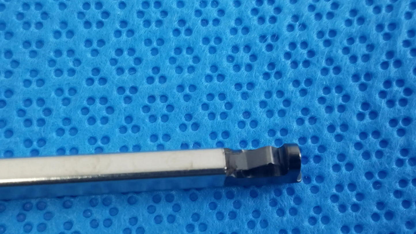 A sleek metallic torque wrench with a silver shaft and black hexagonal head for ultrasonic cleaning medical equipment reuse
