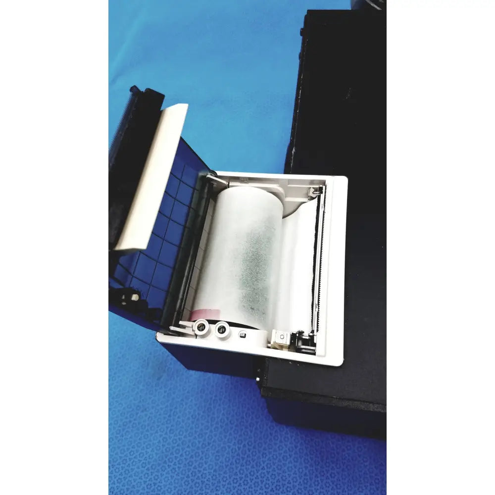 White thermal paper roll inside an open Streck ESR-Auto Plus 506 sedimentation rate analyzer printer for sedimentation rate