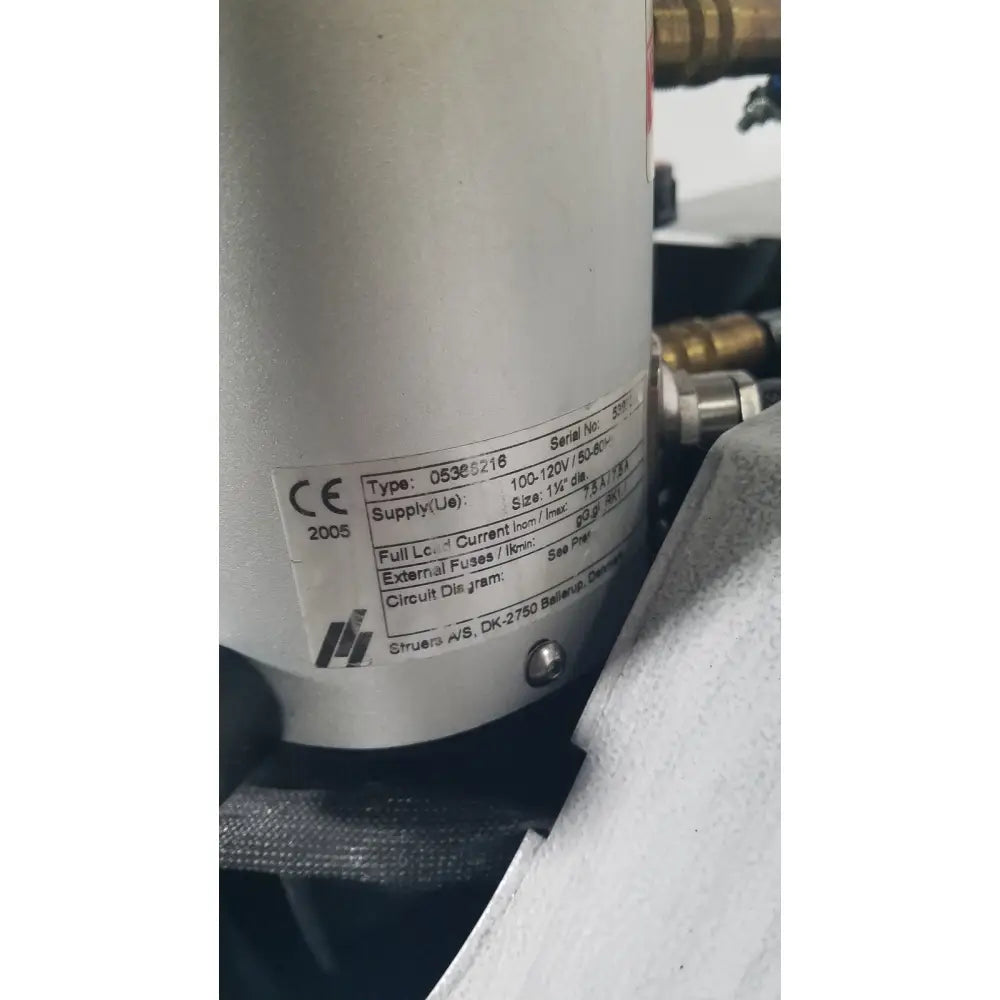 Silver cylindrical industrial pump with label on struers prontopress-20 dual-cylinder metallographic specimen hot mounting machine