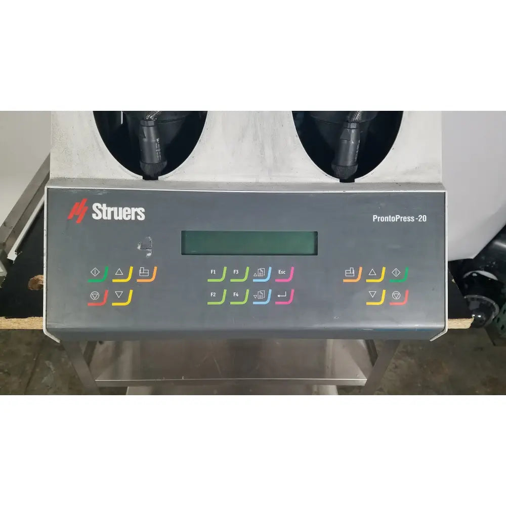 Control panel of a gray struers prontopress-20 dual-cylinder metallographic specimen hot mounting machine with colorful buttons and digital display