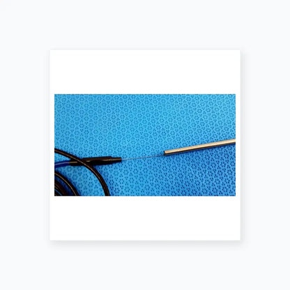 A sleek metallic electrode probe with black cable on blue surface for Stryker lightweight sterilization box medical equipment