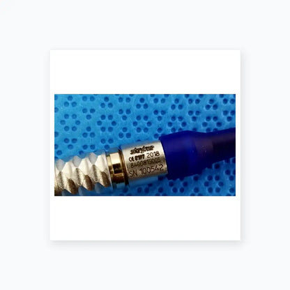 Silver-colored metallic connector with blue cap engraved stryker serial number for lightweight sterilization box medical equipment