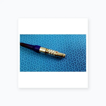 Silver metallic connector with blue insulated cable and textured grip on stryker multigen 2 lightweight sterilization box for reuse medical equipment