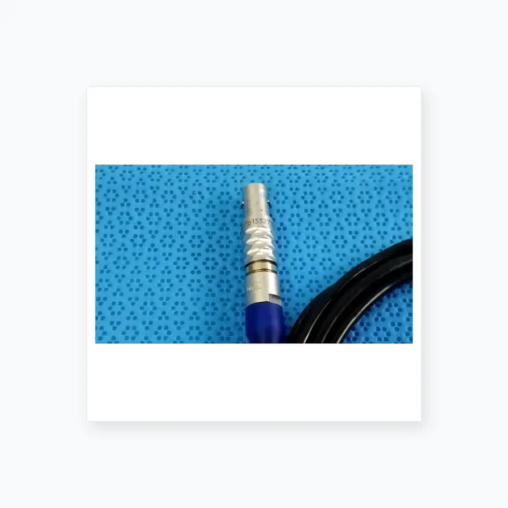 Silver bnc connector with blue insulated cable on the back side of stryker 0406-650-400 medical equipment box for reuse medical equipment