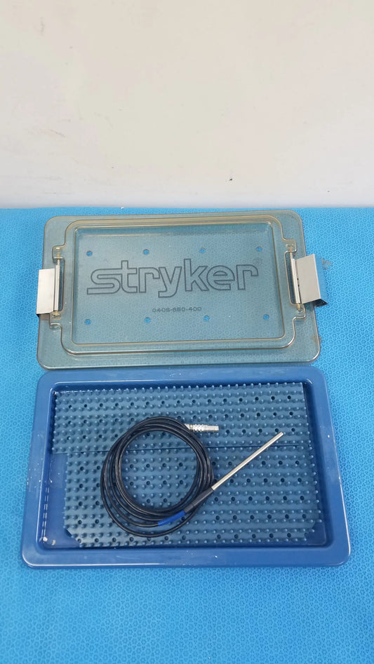 Blue stryker 0406-650-400 sterilization box with black coiled cable and metallic electrode probe for reuse medical equipment