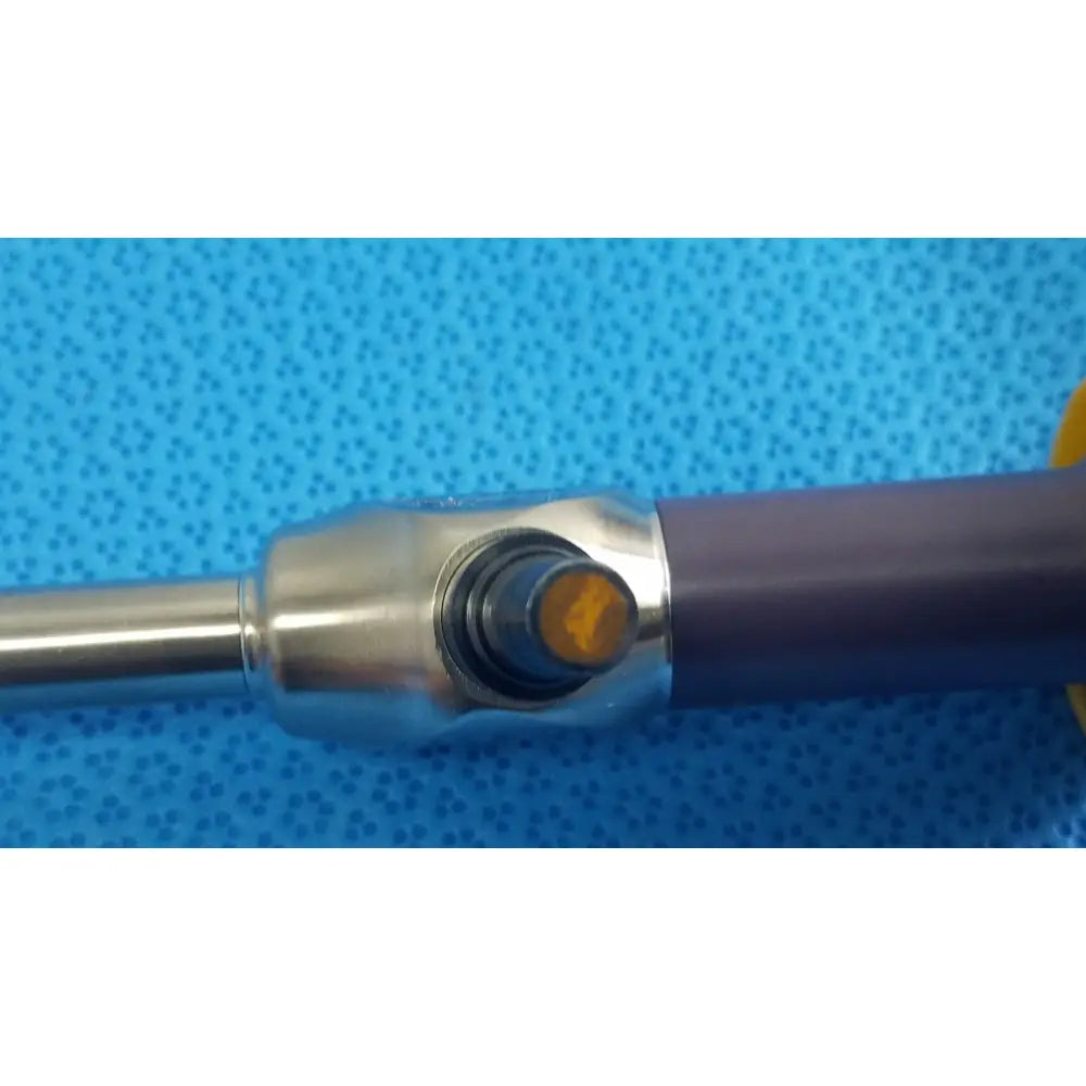 Stryker precision 10mm 0° autoclavable endoscope with purple handle, metallic joint, and amber-tinted tip for reuse medical use