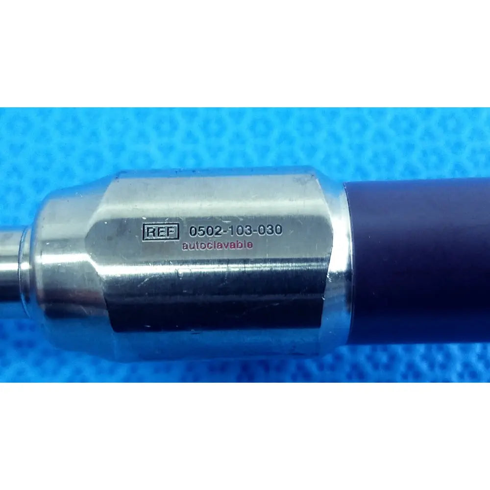 Silver metallic handle of stryker precision 10mm 30° autoclavable endoscope with dark blue grip and engraved number 0502-103-030