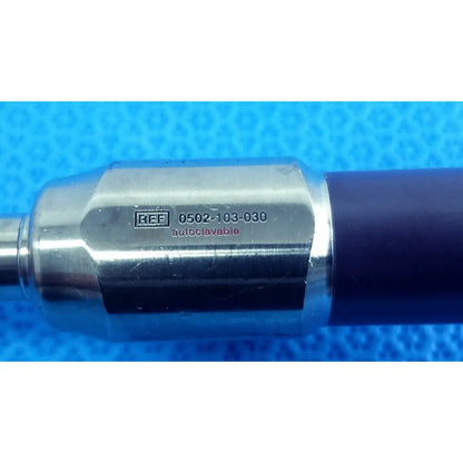 Silver metallic handle of stryker precision 10mm 30° autoclavable endoscope with dark blue grip and engraved number 0502-103-030