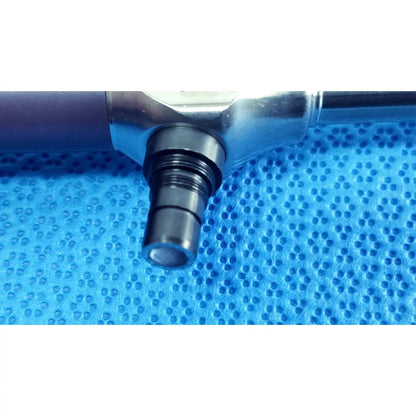 Silver metallic stryker precision 10mm 30° autoclavable endoscope with threaded black tip on blue textured surface