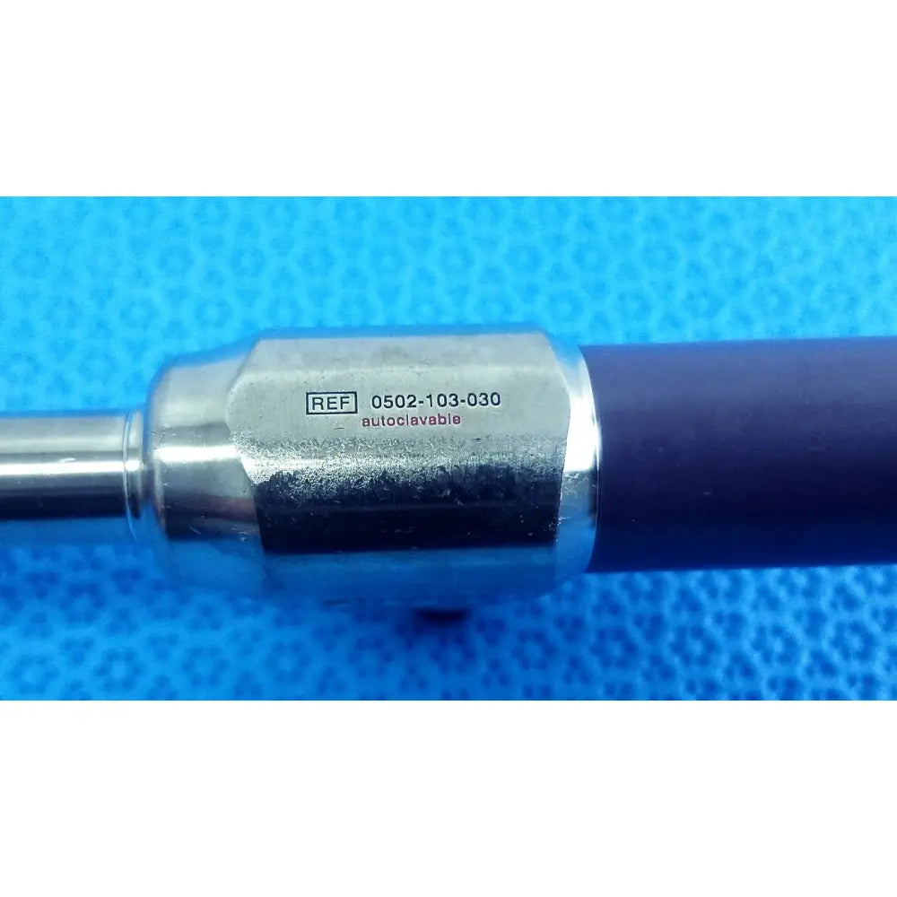 Silver metallic stryker precision 10mm 30° autoclavable endoscope with dark blue handle and engraved reference number