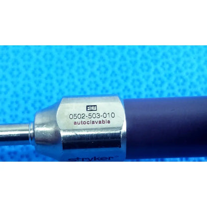 Silver metallic stryker 5mm 0° autoclavable endoscope with dark blue handle and engraved label for reuse medical use
