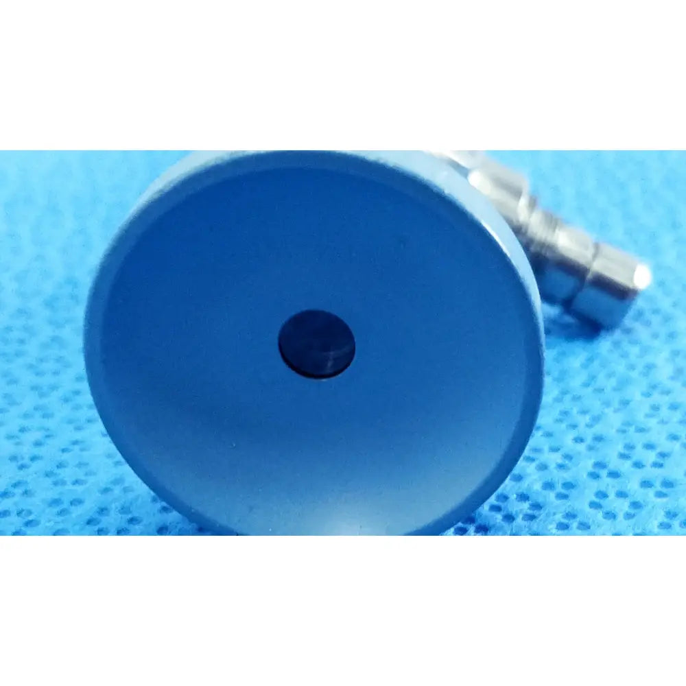 Blue circular plastic coated metal component with central hole on back side of stryker ideal eyes 5mm autoclavable endoscope