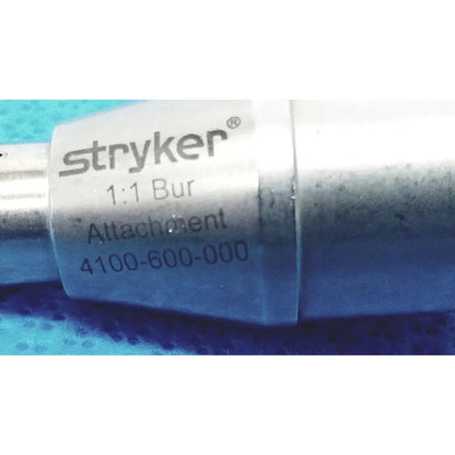 Stryker 1:1 bur attachment model 4100-600-000 with metallic silver finish and engraved branding for reuse medical