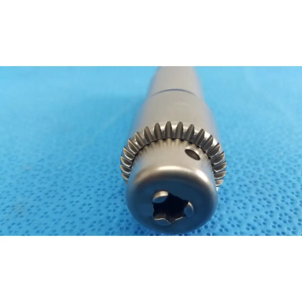 Stryker 1/4 inch silver metallic surgical drill bit with gear-like fluted edge and hexagonal drive socket for reuse medical orthopedic instruments